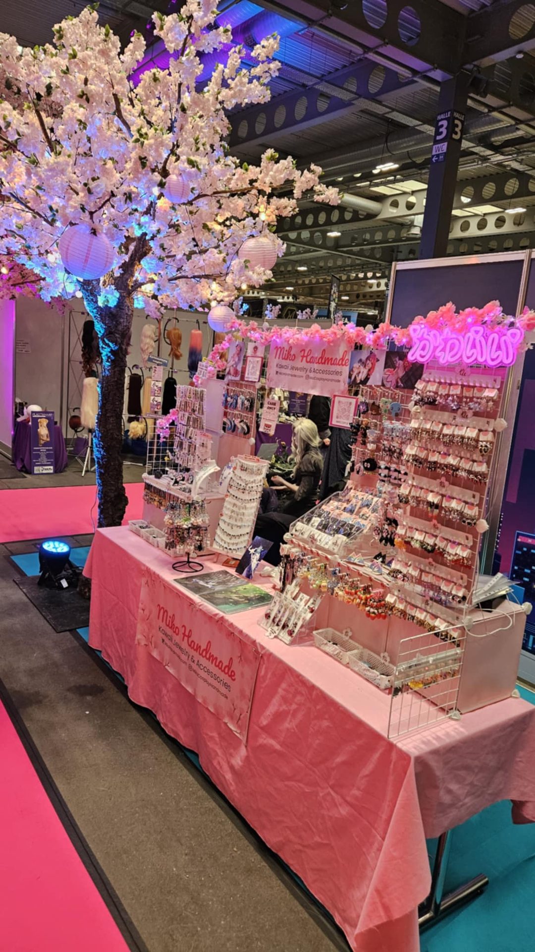 Miko Handmade booth with pink neons and kawaii atmosphere